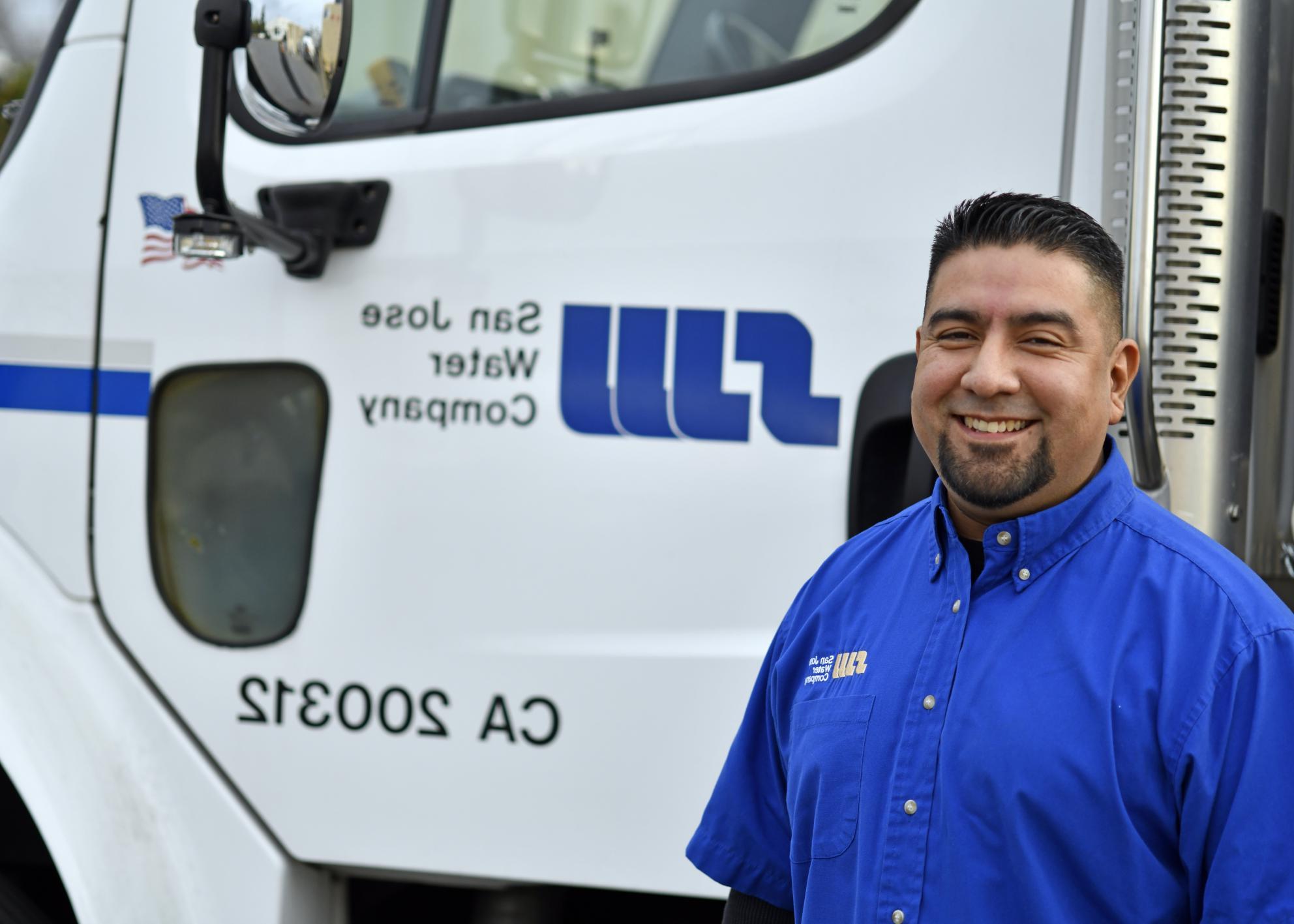 SJW employee in front of SJW truck